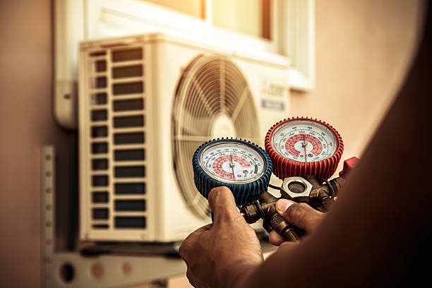 Professional Air Conditioning Service technician working in Pleasant Plain, OH